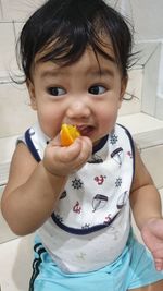 Portrait of cute girl holding ice cream
