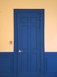 Closed blue door of building