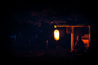 Woman standing at night