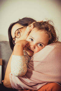 Portrait of smiling woman at home