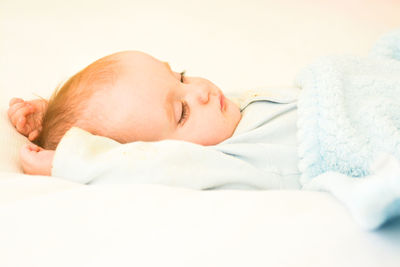 Cute baby sleeping on bed