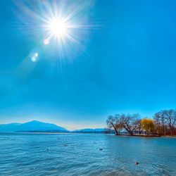 Scenic view of sea against blue sky
