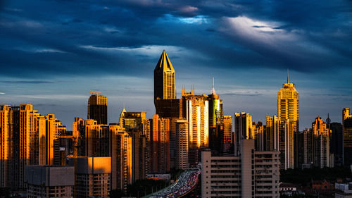 Skyscrapers in city against sky