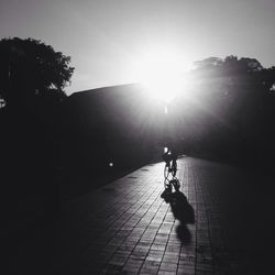 Shadow of people on road