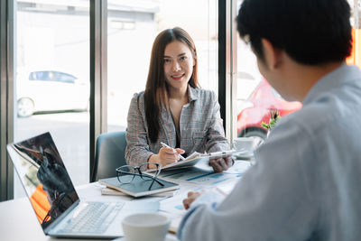 Portrait of businesswoman working at office