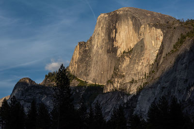 Low angle view of rock formations against sky