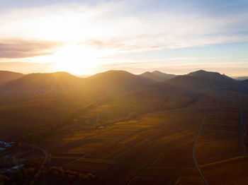 Scenic view of mountains against sky during sunset