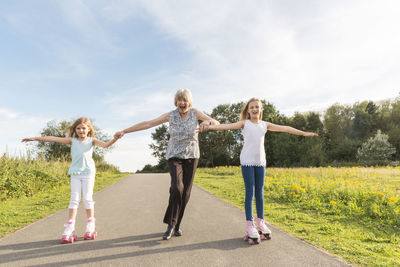 Grandmother and granddaughters roller skating