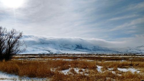 Scenic view of snow field against sky