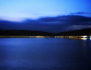 Scenic view of sea against sky at night