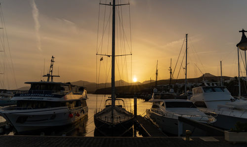 Boats moored at harbor