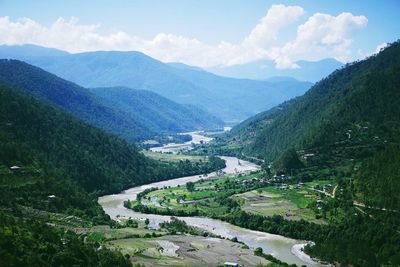 Scenic view of mountains against cloudy sky