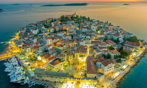 High angle view of cityscape by sea