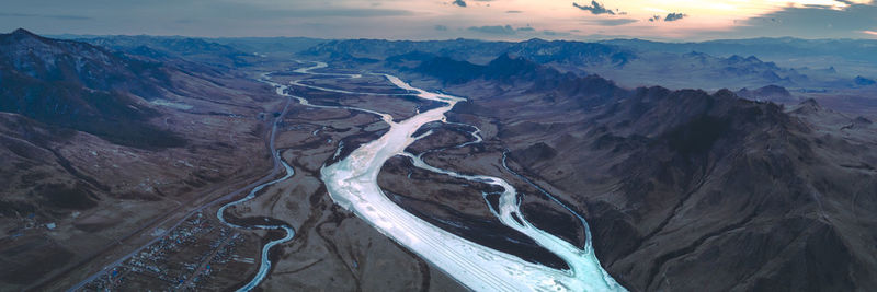 High angle view of river valley against sky