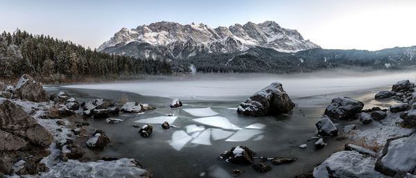 Scenic view of frozen lake against mountains