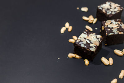 High angle view of chocolate cake on table against black background