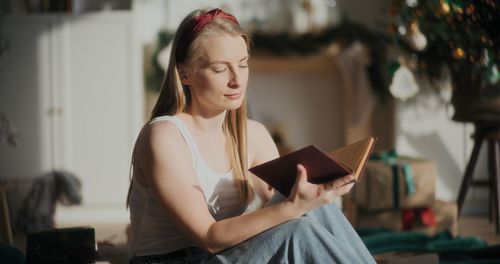 Young woman reading book