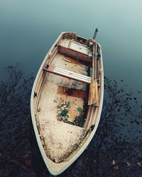 High angle view of boat moored on lake against clear sky