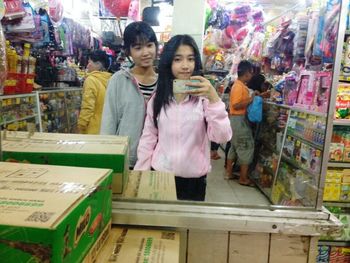 Portrait of smiling girl standing in store