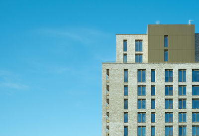 Low angle view of building against blue sky