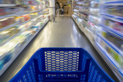 Blurred motion of illuminated lights at store