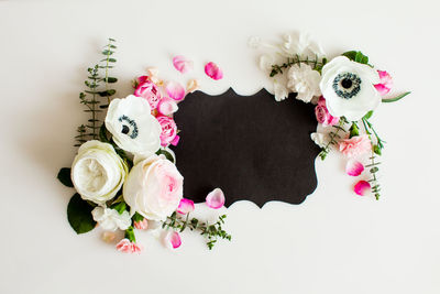 Close-up of rose bouquet against white background