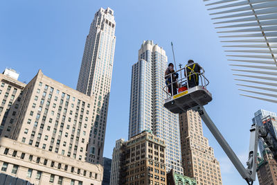 Low angle view of skyscrapers against clear sky