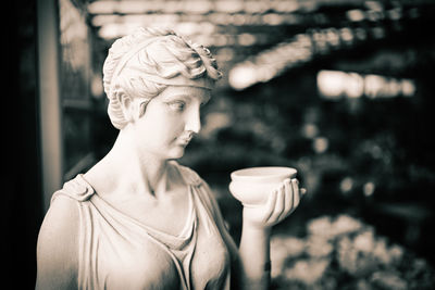 Portrait of woman holding coffee cup