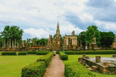 Panoramic view of temple amidst buildings against sky