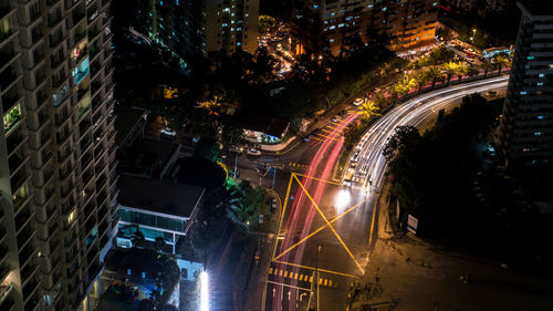 High angle view of light trails on city street at night