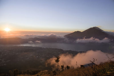 Sunrise on agung volcano and batur lake aerial view, bali, indonesia