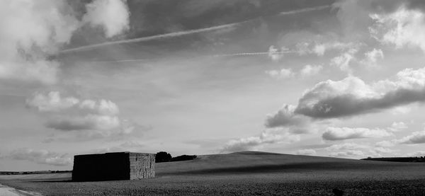 Panoramic view of field against sky