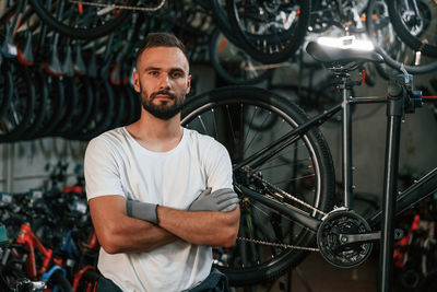 Portrait of young man riding bicycle