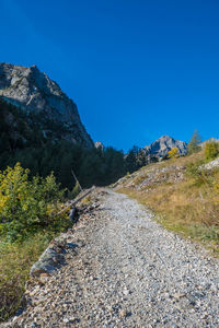 Scenic view of mountains against clear blue sky