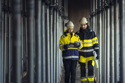 Engineers talking at building site