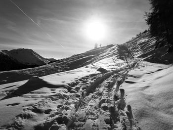 Scenic view of snow covered mountains against sky