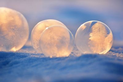 Close-up of crystal against sky