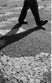 Low section of people standing on tiled floor