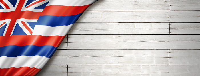 High angle view of flags against blue wall