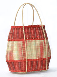 Close-up of basket over white background