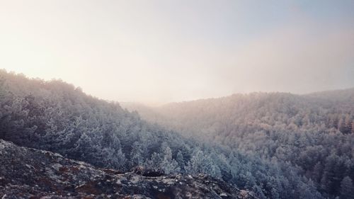 Scenic view of mountains against sky during winter