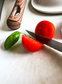 High angle view of tomatoes in plate on table