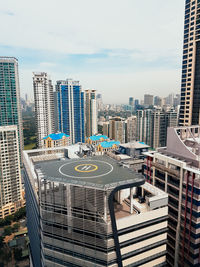 High angle view of modern buildings in city against sky