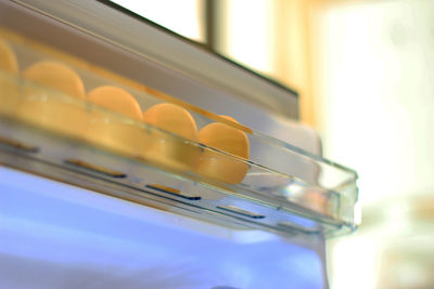 Chicken eggs on shelf of refrigerator