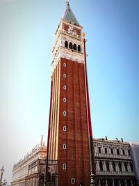 Low angle view of clock tower against sky