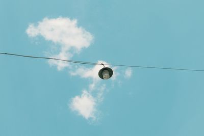 Low angle view of street light against sky