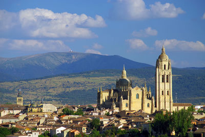 Buildings in city against sky