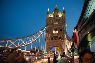 Low angle view of illuminated building against blue sky