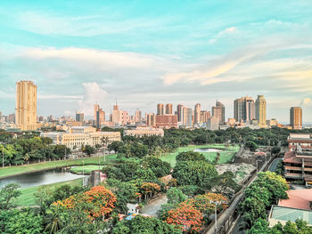 Panoramic view of buildings in city against sky