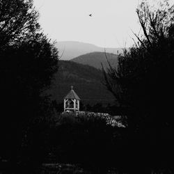 View of temple against mountain at night